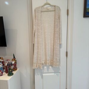 Elegant Beige Women's Cardigan with Fringe will keep you warm and cozy